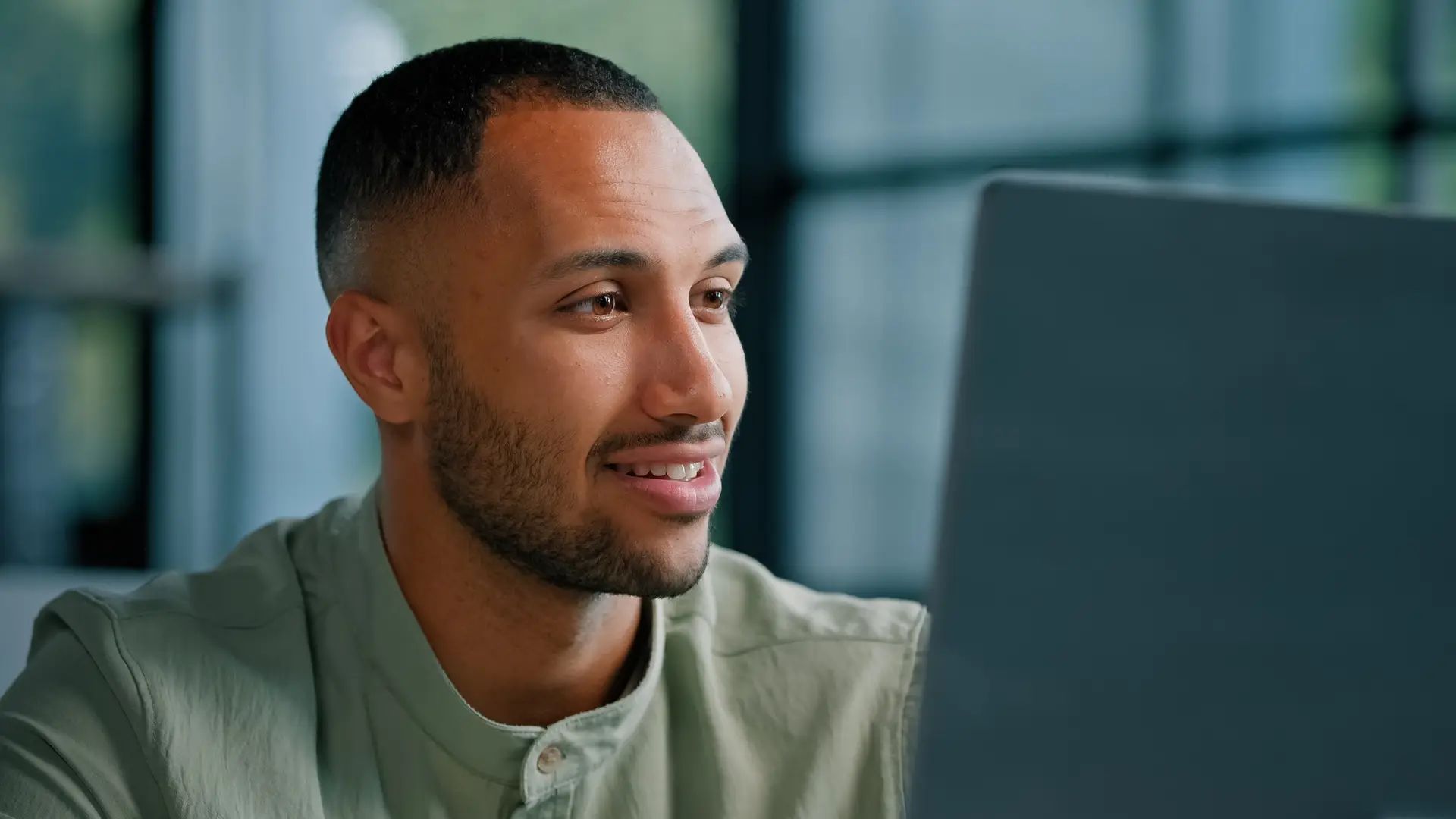 Closeup pensive thoughtful African Latina man manager writer journalist specialist entrepreneur